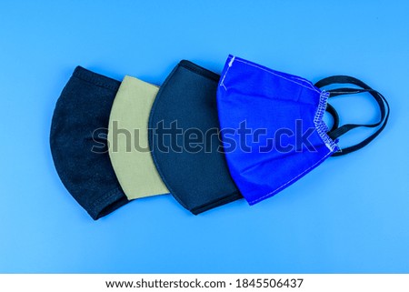 Protective face masks on blue background. Healthcare and medicine concept