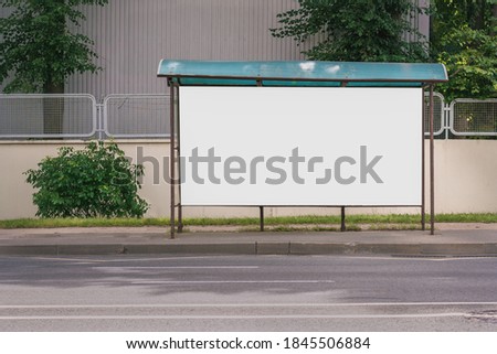 white empty banner with mockup place stands on sidewalk near road front view