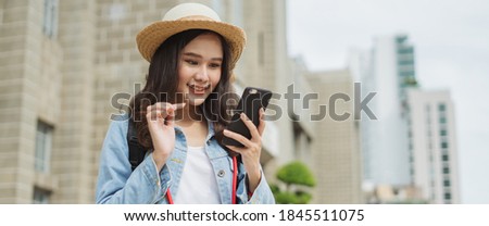 Asian woman traveling and selfie photo by boat transportation to prevent covid19 virus infection.
Tourist female using smartphone search for route location hotel at thailand