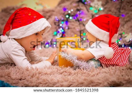 
boys in santa claus hats wish happy new year