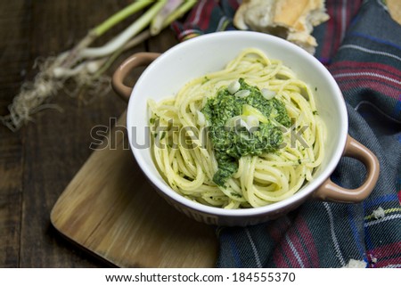 bowl of spaghetti, Spinach Dip,  olive oil on dark wood and rustic environment.