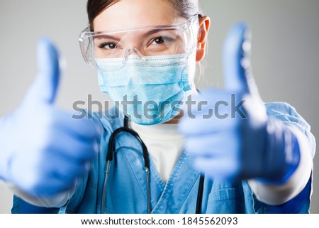Caucasian female doctor showing two thumbs up,medical professional woman giving both thumbs up gesture,positive case development,successful patient recovery after treatment,overcoming disease illness
 Royalty-Free Stock Photo #1845562093