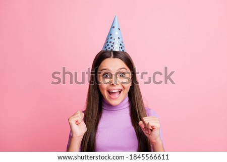 Close-up portrait of her she nice attractive pretty cute small little cheerful cheery amazed long-haired girl wear paper cap having fun celebratory isolated over pink pastel color background