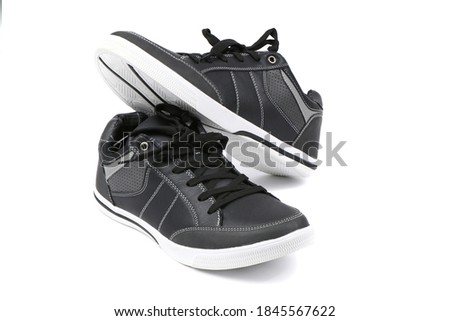 Pair of black women sneakers isolated on white background. High resolution photo. Full depth of field.