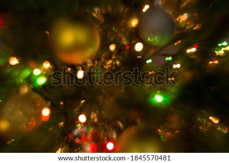 ?hristmas background with ?hristmas tree and Christmas lights.
