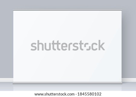 White rollup banner with copy space standing on the grey wall background. Horizontal wide banner realistic mockup. Vector banner template design. The white backdrop for image or text placement. Royalty-Free Stock Photo #1845580102