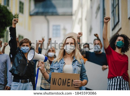 Group of people activists protesting on streets, women march and demonstration concept.