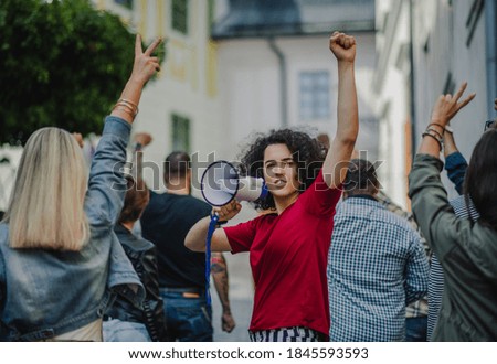 Group of people activists protesting on streets, strike, demonstration and coronavirus concept. Royalty-Free Stock Photo #1845593593