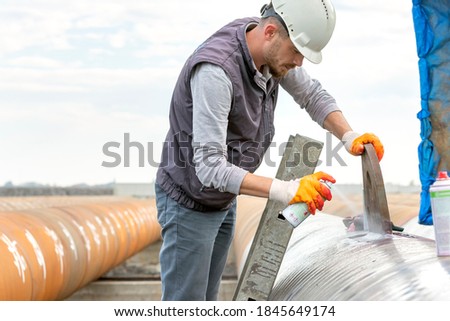 The non-destructive testing technician is inspection to welds of eyebolt with liquid penetrant testing method. Royalty-Free Stock Photo #1845649174