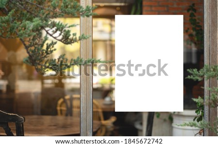 White paper poster mockup displayed outside the building restaurant. Marketing and business concept.  Royalty-Free Stock Photo #1845672742