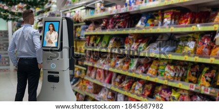 iot smart retail futuristic technology concept,man try to ask Shopkeeper รื  smart Digital Signage display in the shop or retail advice to choose select ,buy cloths and give a rating of products 