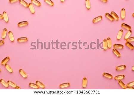 Vitamins Omega 3 6 9 fish oil , vitamin D on a pink background for health lifestyle with copyspace Royalty-Free Stock Photo #1845689731