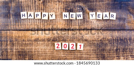Happy New Year 2021. horizontal orientation on wooden background.