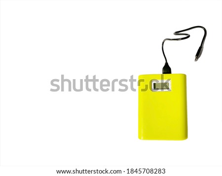 Power bank for charging mobile devices on white background. Selective focus