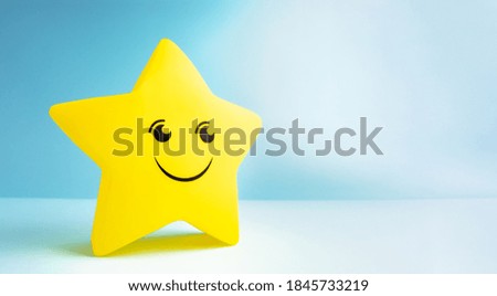 Large gold star on a blue background.