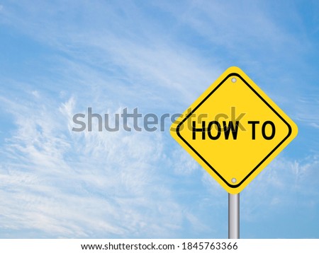 Yellow color transportation sign with word how to on blue cloud sky background