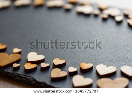 Wooden hearts in retro style as concept of love. Place for text.
