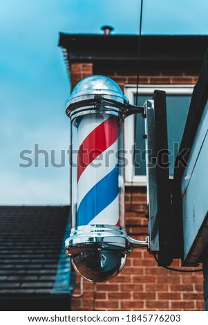 Blue red and white barbershop pole
