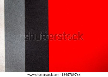Red, grey, black and white papers background and texture