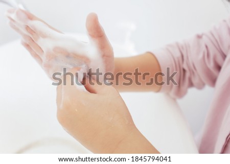 A boy who washes his hands clean
