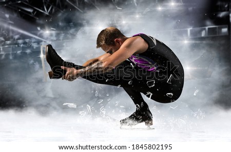 Sit spin. Man figure skating in action on dark background. Sports banner. Horizontal copy space background