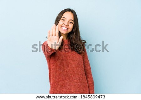 Young mixed race hispanic woman isolated smiling cheerful showing number five with fingers.