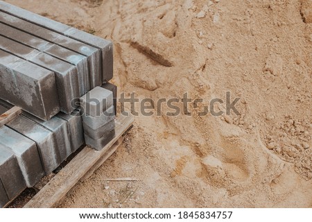 Tools at the construction site for laying paving slabs - stone block paving stones for cement mortar