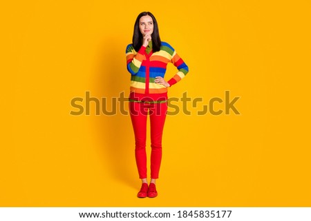 Full body photo of young attractive girl think idea creative plan hand touch chin look empty space isolated over yellow color background