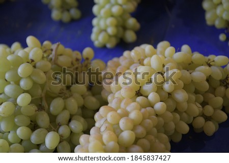 Grapes close-up. Selective and soft focus. Ripe and juicy grapes are sold at the farmers ' bazaar
