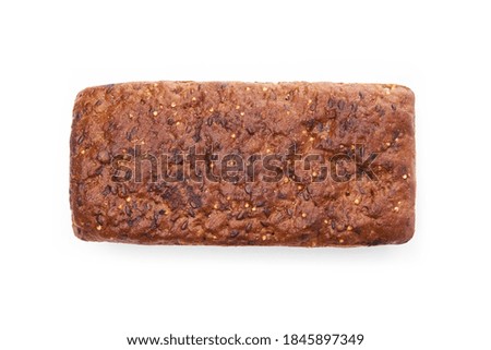 Loaf Of Whole Grain Bread. Detailed close-up of sliced grain bread on white background. Homemade healthy bread. Bakery - gold rustic crusty loaves of bread and buns. Flat lay. Food concept.