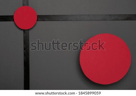 Top view of black ribbon, red round labels for text or price on the grey surface.Template for sales promotion