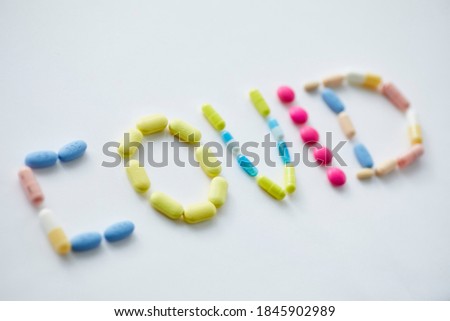 Assortment of Pills on White Background