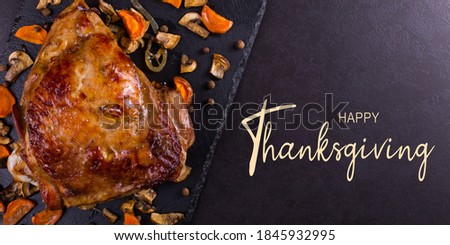 Thanksgiving greetings. Cooked apetite turkey on table, top view. Kaligraphic capital inscription.