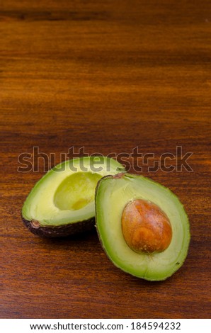 avocado over a wooden boad.