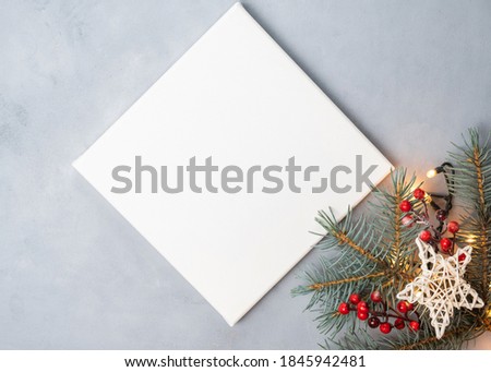 Blank canvas board for Christmas message. Mockup poster and Christmas decoration.