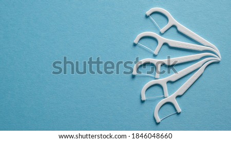 Dental hygiene concept. Set of dental floss, toothpick. Plastic white dental toothpick with floss. Dental floss Royalty-Free Stock Photo #1846048660