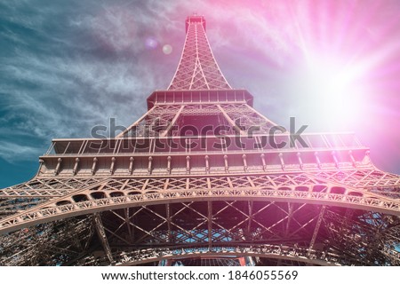 The Eiffel Tower with the sun behind it