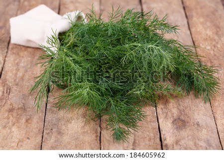 fresh green dill on a wooden background