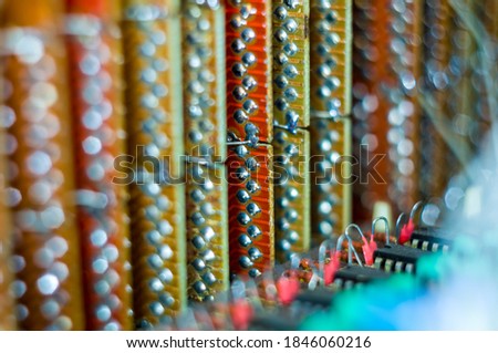 Vintage electronic circuit boards with radio parts and chips, close-up, macro photo