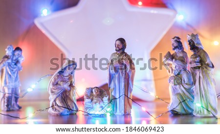 Picture of Christmas bethlehem made of wooden figures, with nice light background