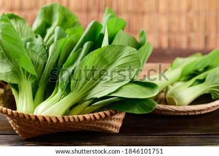 Fresh Bok Choy or Pak Choi(Chinese cabbage) in bamboo basket on wooden background, Organic vegetables Royalty-Free Stock Photo #1846101751