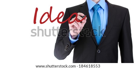 Businessman writing word Idea on transparent board