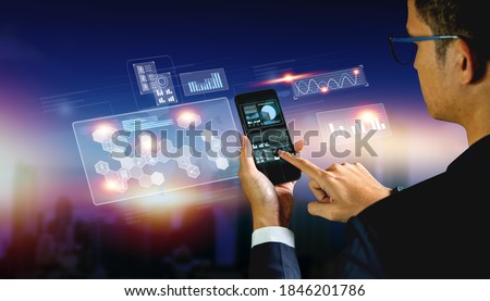 Businessman engineer use tablet digital virtual screen for monitoring business system. Digital technology business and Smart business.