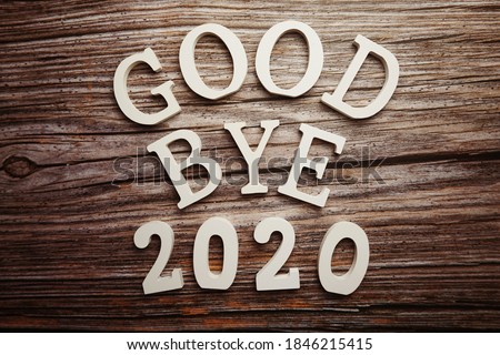 Goodbye 2020 alphabet letter on wooden background Royalty-Free Stock Photo #1846215415