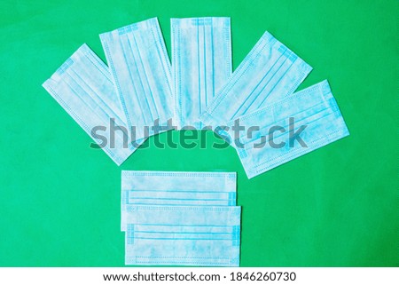 Top view of medical masks for prevention coronavirus spread on green screen background