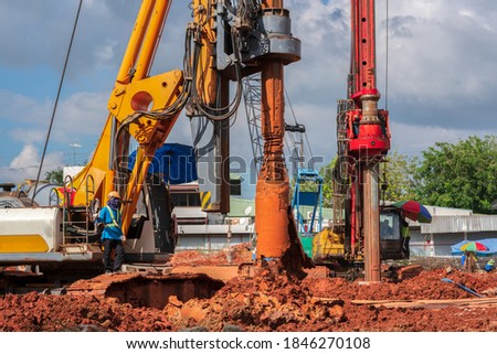 Industrial drilling rig machinery on building construction site.Drilling vehicle construction concrete piles on working Royalty-Free Stock Photo #1846270108