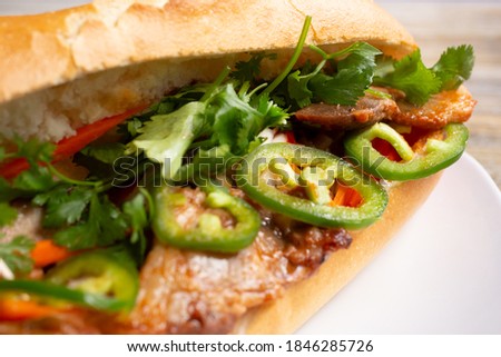 A view of a beef and jalapeño banh mi sandwich.