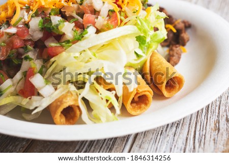 A view of a taquitos plate.