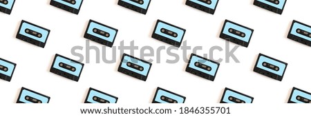 Cassette tapes pattern on a white background. Creative banner concept.