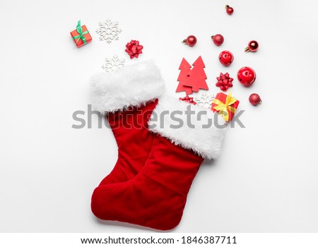 Composition with Christmas socks on white background